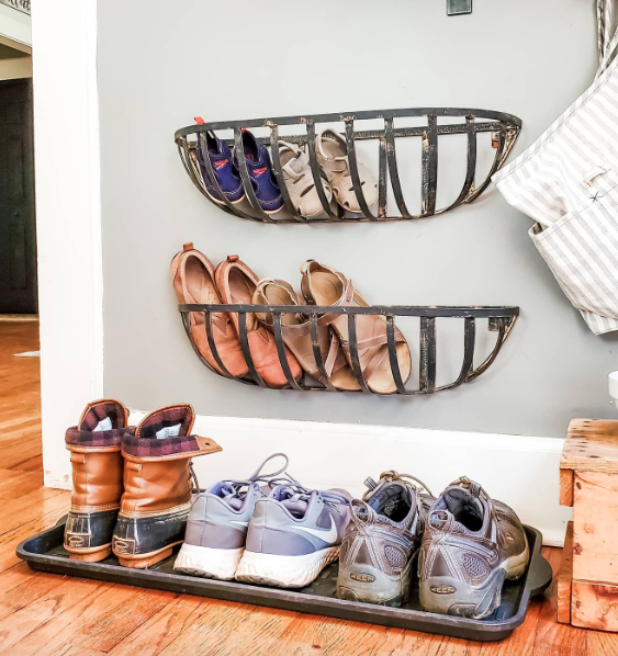 Shoe storage on wall and floor. 
